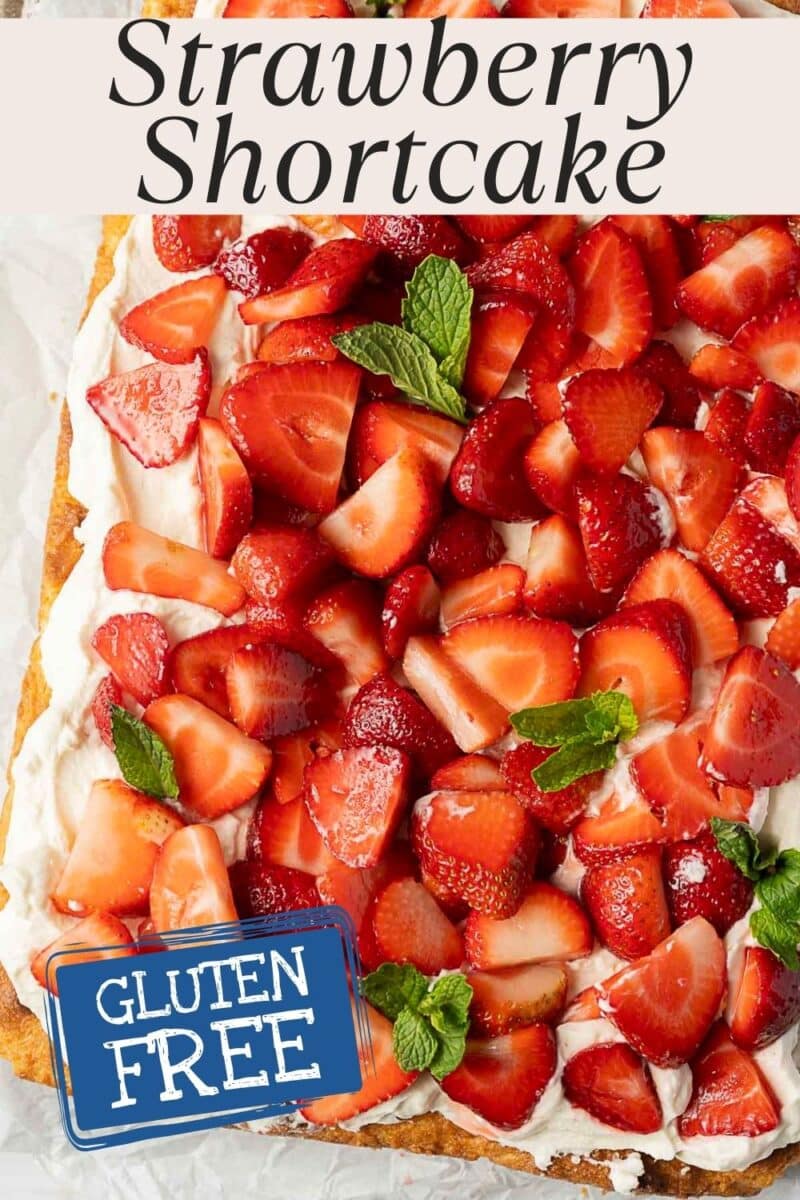 A Gluten Free Strawberry Shortcake topped with whipped cream, fresh sliced strawberries, and mint leaves, featuring a "Gluten Free" label on the image.