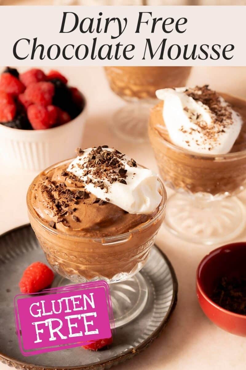 Three glass cups of dairy free chocolate mousse topped with whipped cream and chocolate shavings, berries on the side, and a “Gluten Free” label in the foreground. Indulge in this rich, creamy treat perfect for any occasion.