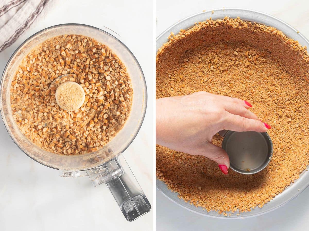 A food processor with crushed graham crackers on the left; on the right, a hand presses the crumb mixture into a pie pan with a measuring cup.