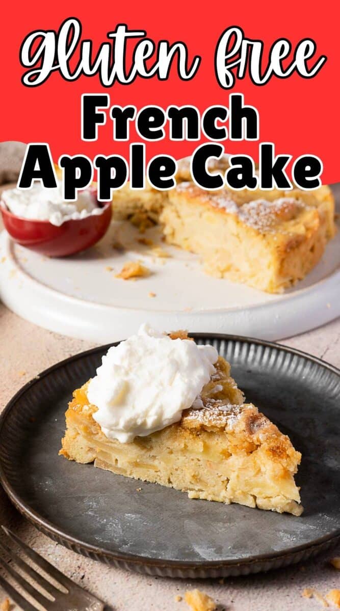 A slice of gluten free apple cake topped with whipped cream sits on a plate, with more gluten free apple cake and whipped cream in the background.