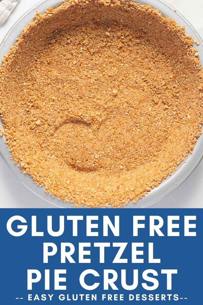 A glass pie dish filled with a pressed gluten free pretzel pie crust, shown from above.