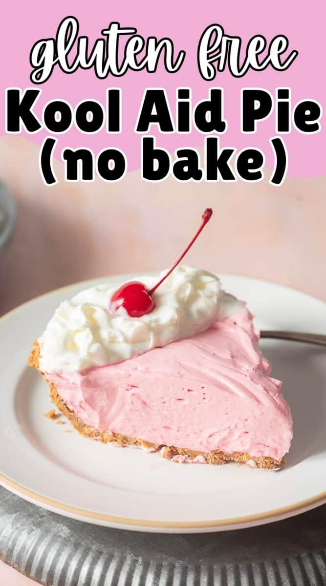 A slice of pink Kool Aid pie with a graham cracker crust, topped with whipped cream and a cherry, on a white plate with a fork.