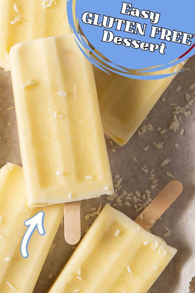 Several yellow pina colada popsicles with coconut flakes on a parchment surface, with text overlay reading "Easy GLUTEN FREE Dessert.