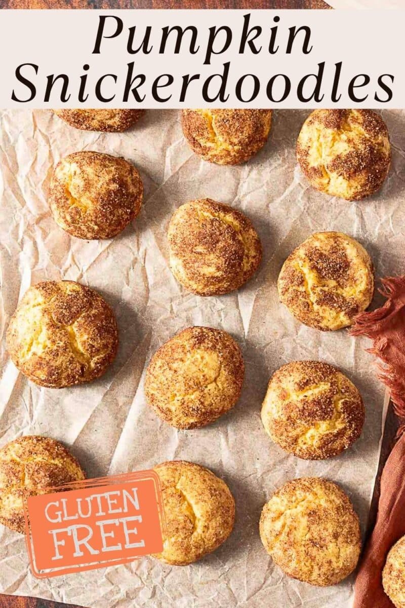 Twelve pumpkin snickerdoodle cookies arranged on parchment paper