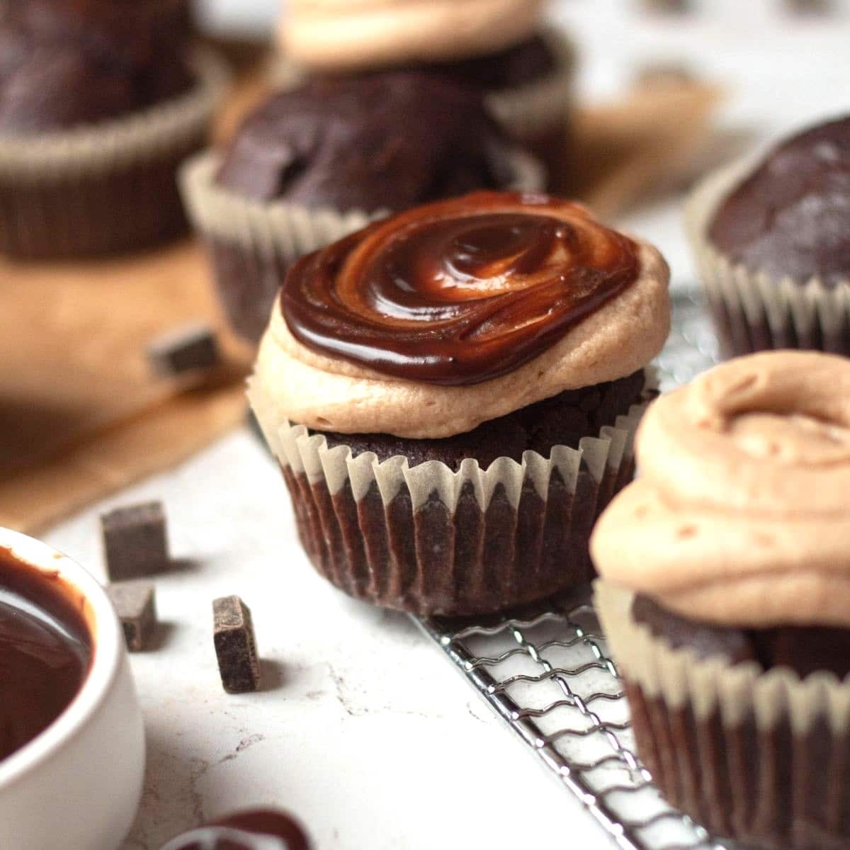 gluten free chocolate cupcakes on top of a wire rach