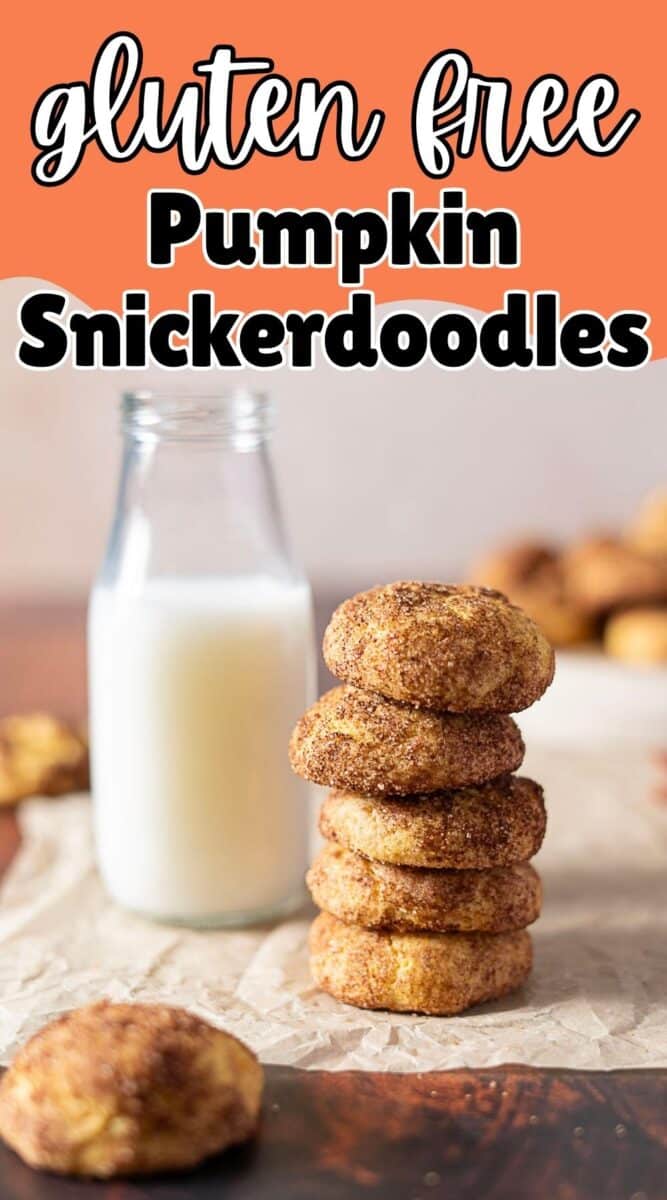 A stack of gluten-free pumpkin snickerdoodle cookies sits in front of a glass bottle of milk on a parchment-lined surface.