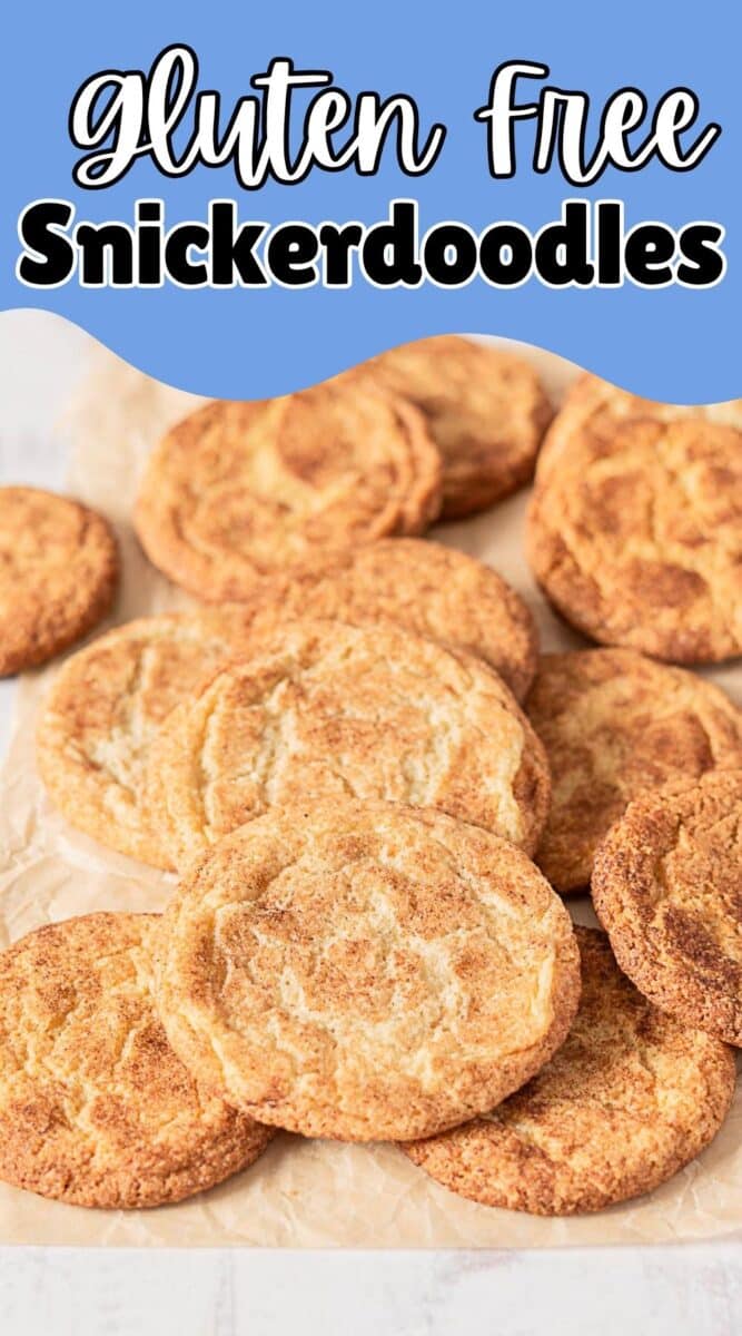 A batch of gluten free snickerdoodle cookies is arranged on parchment paper with a text overlay reading "gluten free Snickerdoodles.