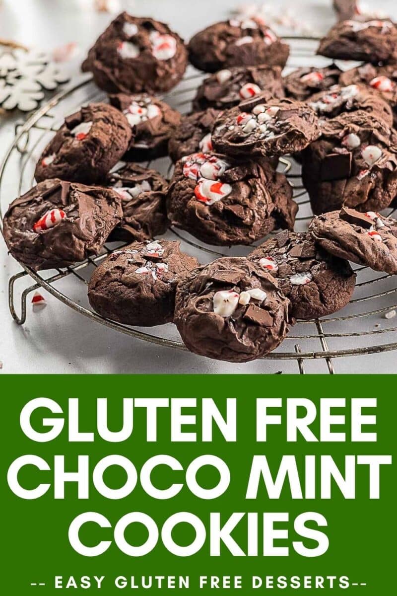 A wire rack holds several Gluten Free Chocolate Peppermint Cookies topped with crushed peppermint.