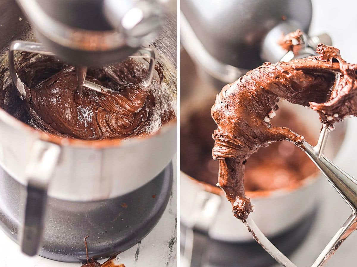 Close-up of a stand mixer with chocolate batter on the beaters and in the mixing bowl.
