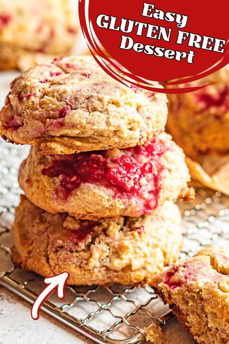 Three gluten-free raspberry scones stacked on a cooling rack, with a text overlay reading “Easy Gluten Free Dessert.” Perfect for fans of gluten free raspberry cookies.