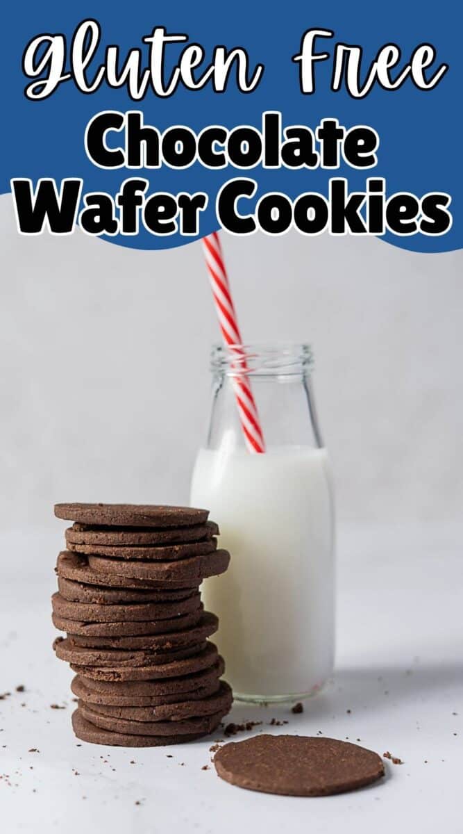 A stack of Gluten Free Chocolate Wafer Cookies sits beside a glass bottle of milk with a red and white striped straw.