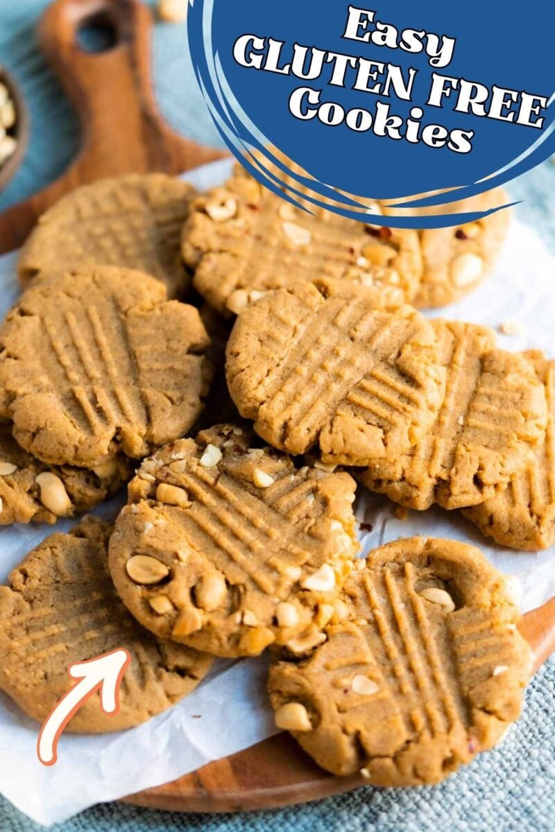 A plate of gluten-free cookies with a crisscross fork pattern and visible chopped nuts, placed on parchment paper. A label on the image reads "Easy Gluten Free Cookies.