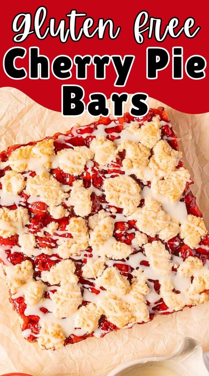 A large square of gluten free cherry pie bars with a crumbly topping and white icing sits on parchment paper, beneath a decorative “gluten free Cherry Pie Bars” text above. Perfect for enjoying classic flavors without gluten!.