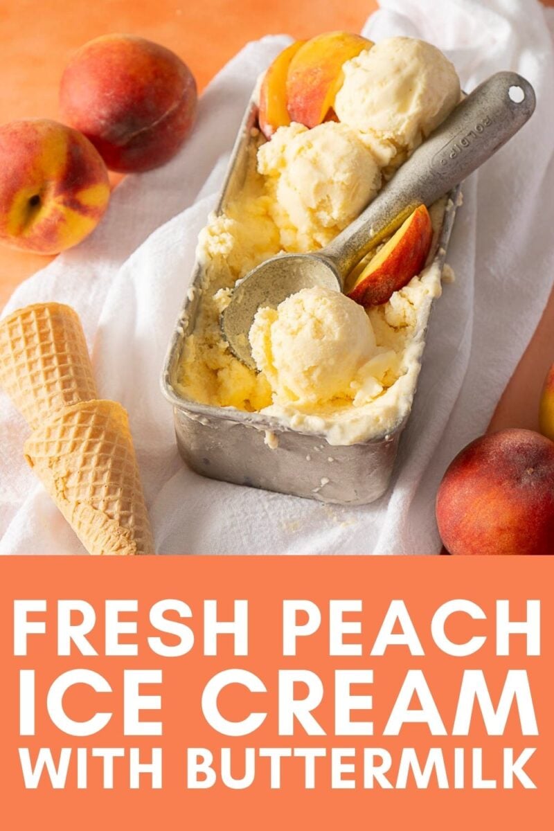 A metal container of peach ice cream with a scooper, fresh peaches, and ice cream cones on a white cloth. Text reads, "Fresh Peach Ice Cream with Buttermilk.