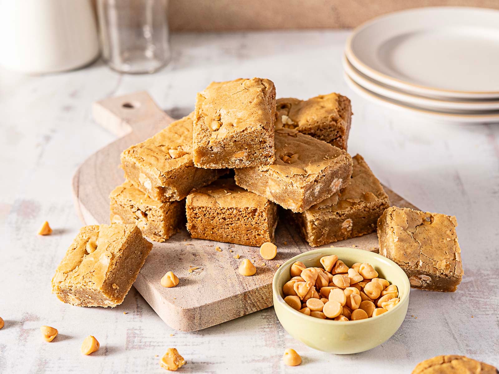Stack of blondies on a wooden board.