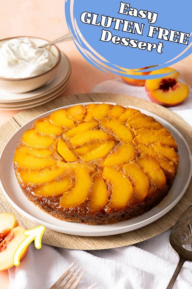 A peach upside down cake sits on a plate next to cream, a sliced peach, and utensils. A graphic reads, “Easy GLUTEN FREE Dessert” in the top right corner, highlighting this delicious upside down cake as the perfect treat for any occasion.